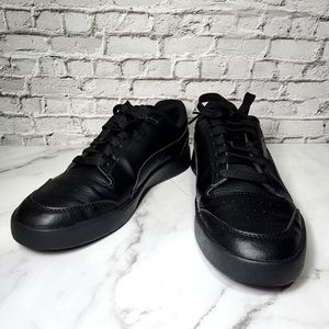 Used Puma black leather sneakers